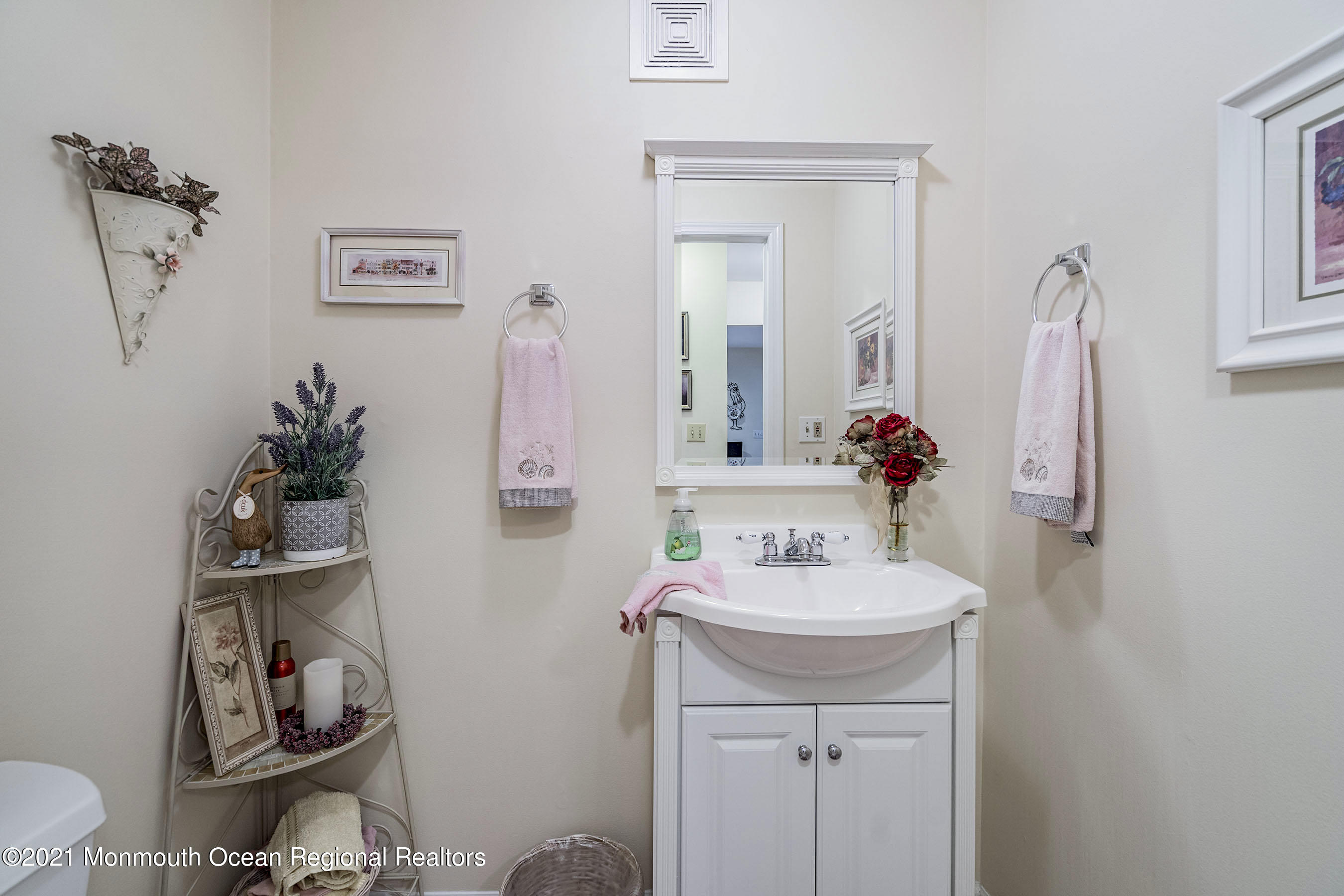 617 Turkey Point Road Brick, NJ 08724 - Photo 19 of 43 a bathroom with a sink and a mirror
