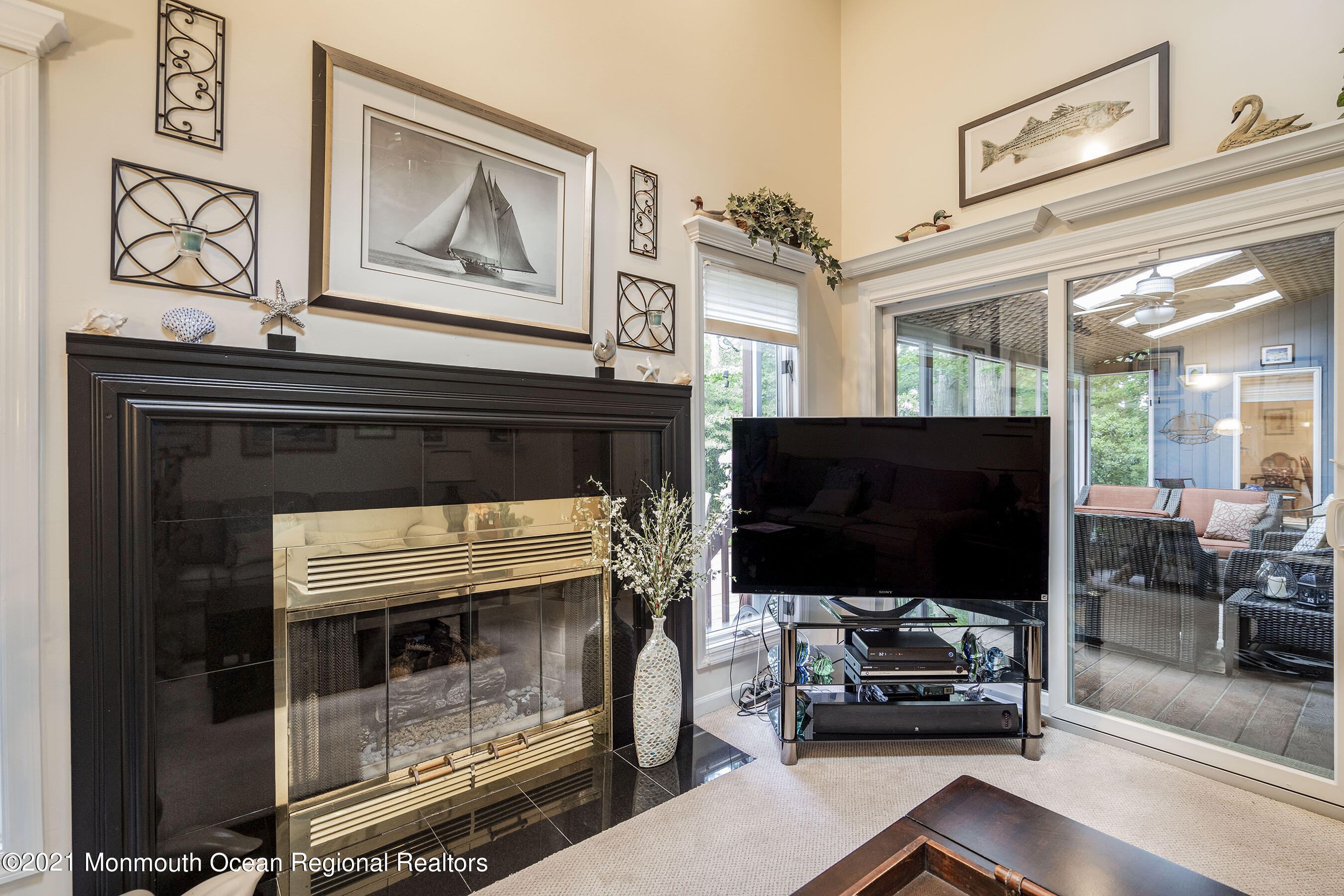 617 Turkey Point Road Brick, NJ 08724 - Photo 21 of 43 a living room with furniture and a flat screen tv
