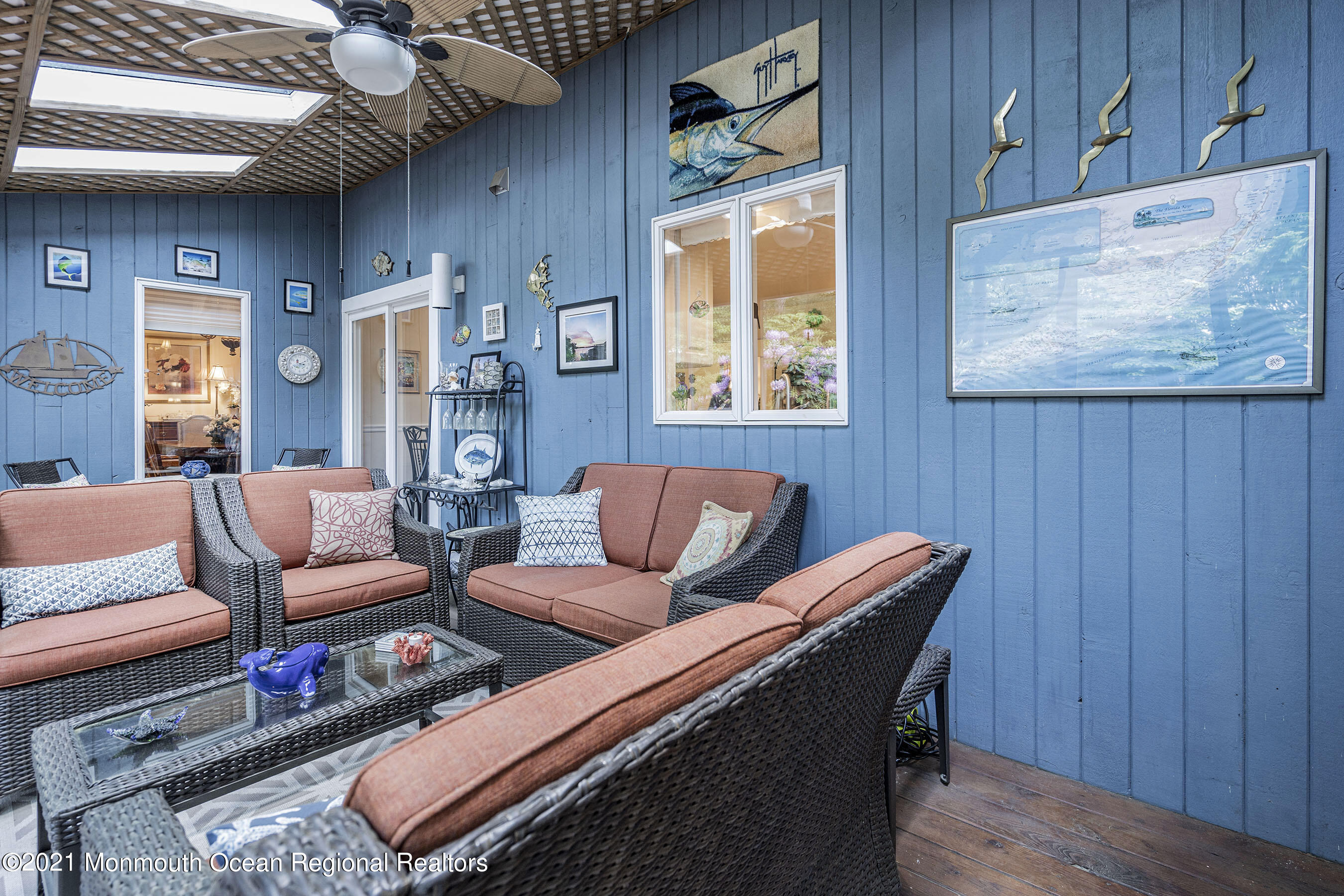 617 Turkey Point Road Brick, NJ 08724 - Photo 23 of 43 a living room with furniture a wooden floor and a large window