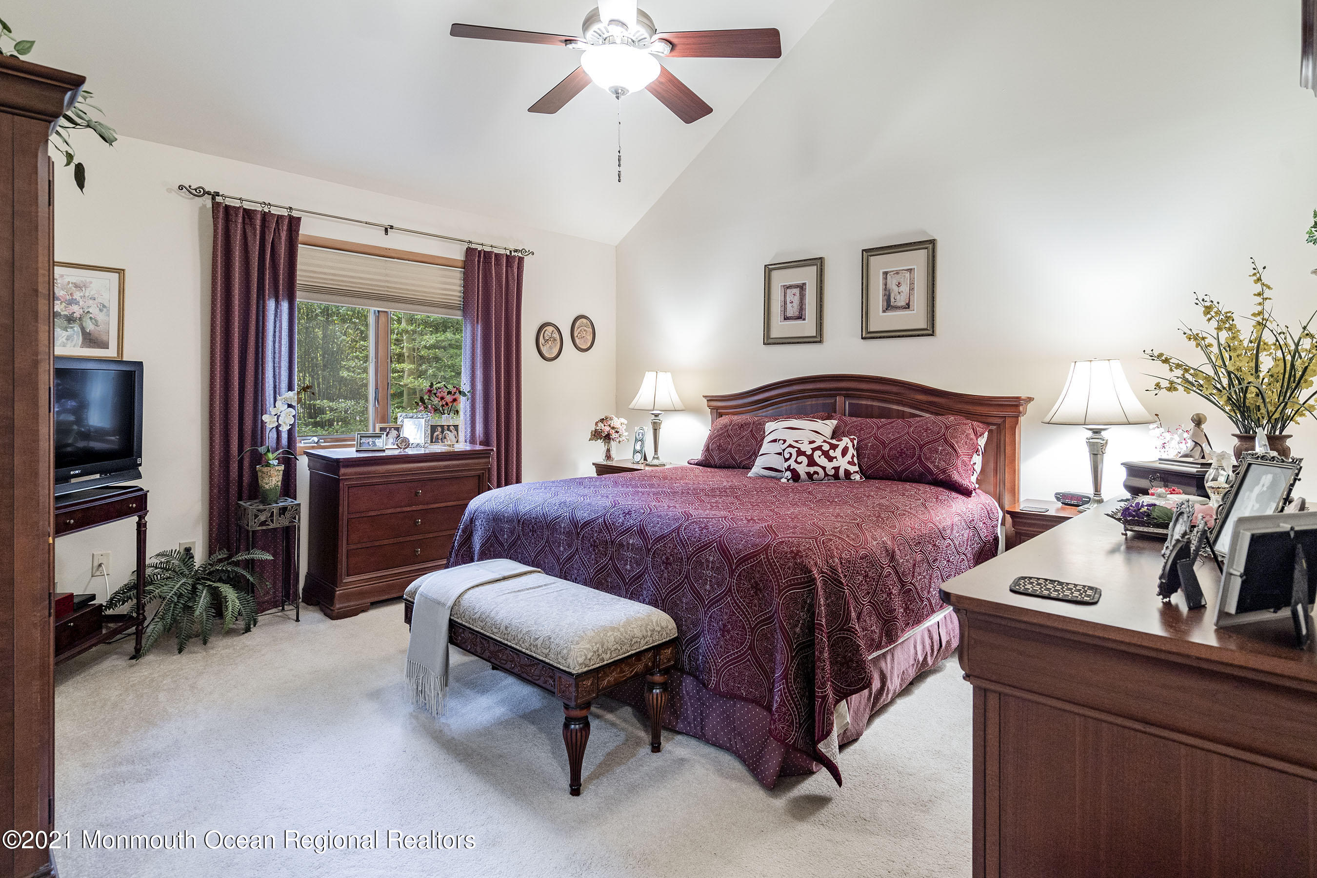 617 Turkey Point Road Brick, NJ 08724 - Photo 25 of 43 a bedroom with a large bed and a potted plant
