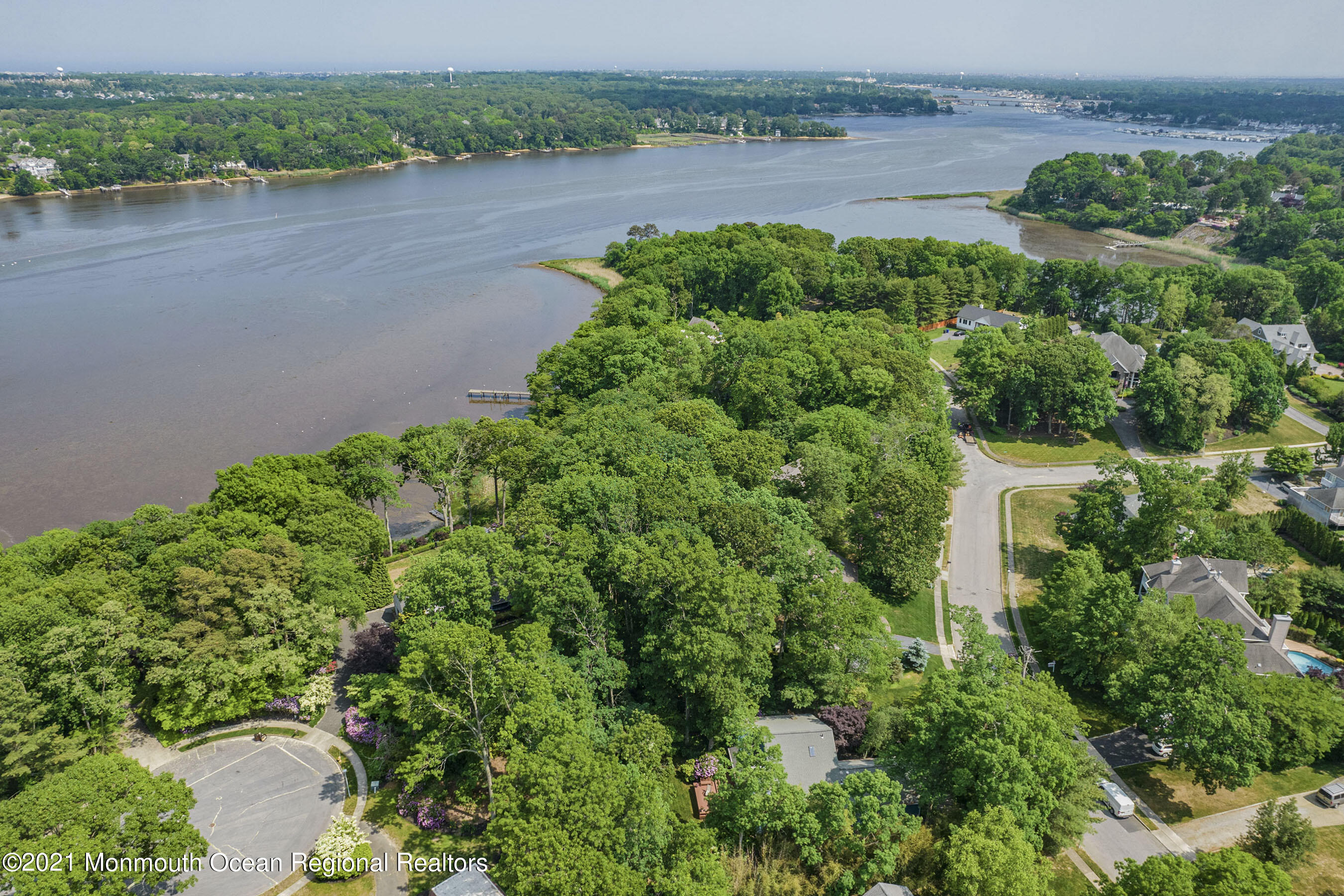 617 Turkey Point Road Brick, NJ 08724 - Photo 5 of 43 an aerial view of a house with a yard and lake view
