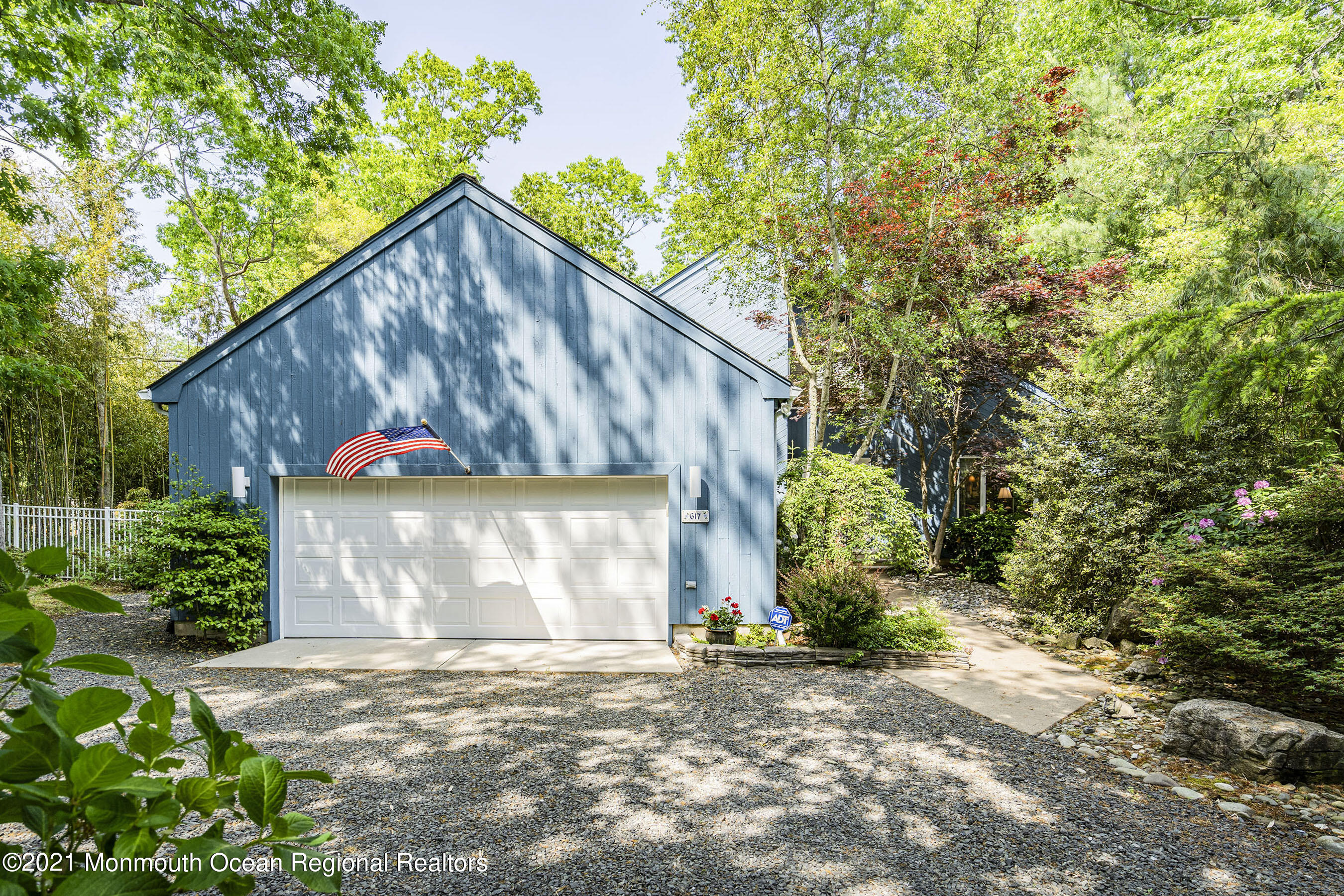 617 Turkey Point Road Brick, NJ 08724 - Photo 7 of 43 a front view of a house with a yard and garage