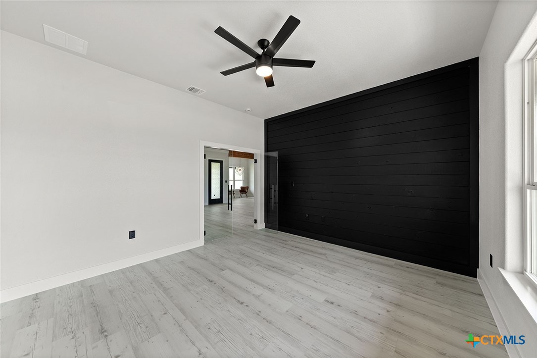1220 Hadley Lane Copperas Cove, TX 76522 - Photo 7 of 17 a view of an empty room with wooden floor