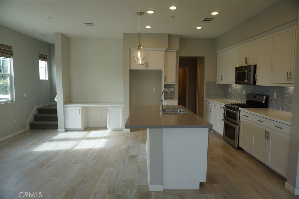 163 Patria Rancho Mission Viejo, CA 92694 - Photo 11 of 25 a large kitchen with stainless steel appliances granite countertop a stove a sink and a refrigerator