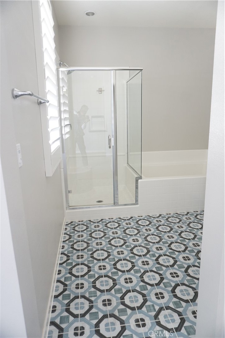 163 Patria Rancho Mission Viejo, CA 92694 - Photo 12 of 25 a bathroom with a shower and a toilet