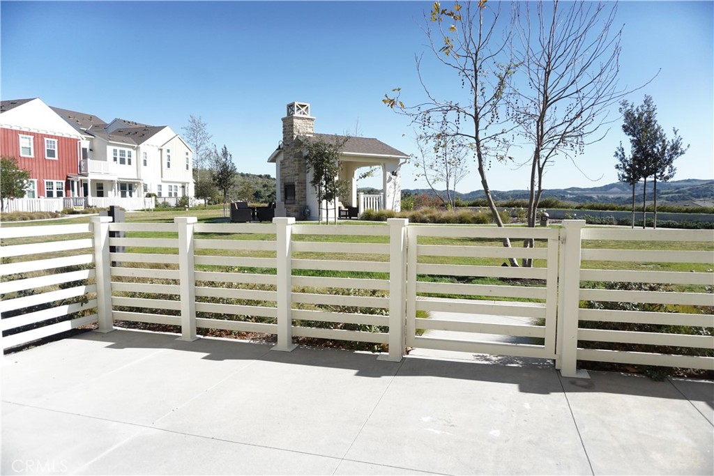 163 Patria Rancho Mission Viejo, CA 92694 - Photo 4 of 25 a view of a house with a yard and parking space