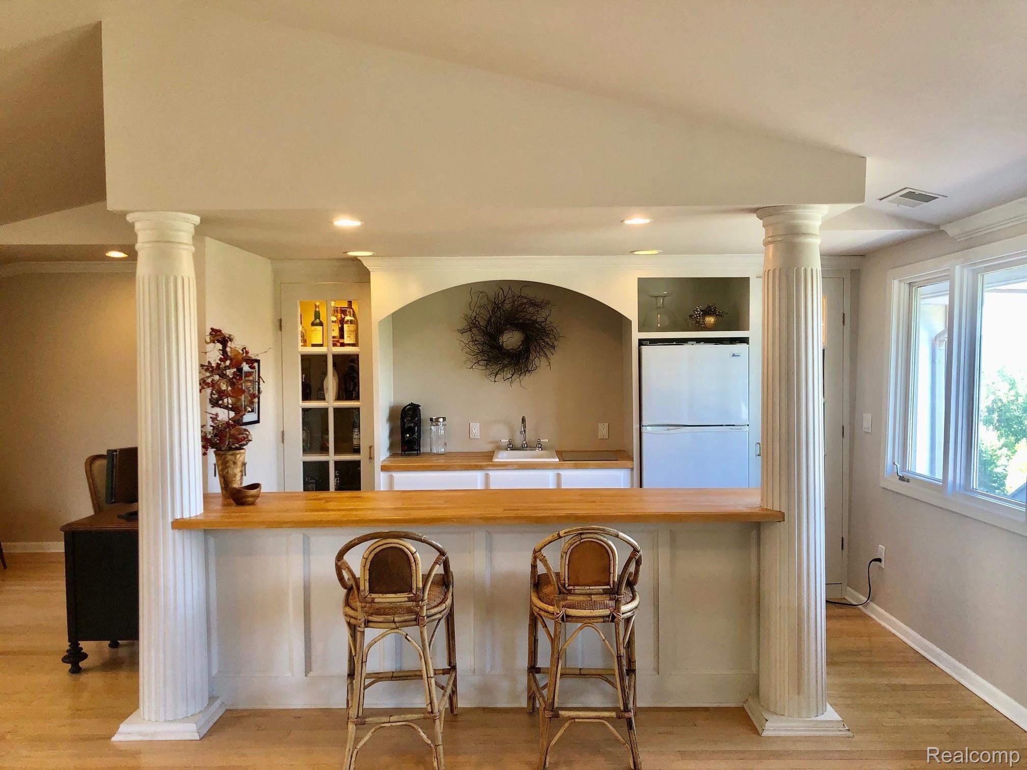 4237 Hough Road Dryden, MI 48428 - Photo 28 of 71 Family room with gas fireplace and hardwood floors