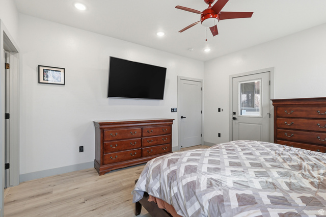 175 North 100 West Providence, UT 84332 - Photo 14 of 45 Master Bedroom featuring light wood-type flooring, ceiling fan, and recessed lighting and private entrance to back covered deck.