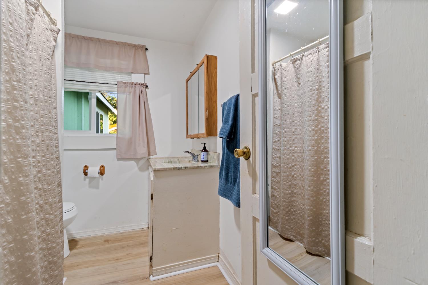 6641 Ribbon Lane Placerville, CA 95667 - Photo 11 of 21 a bathroom with a shower a mirror and a sink