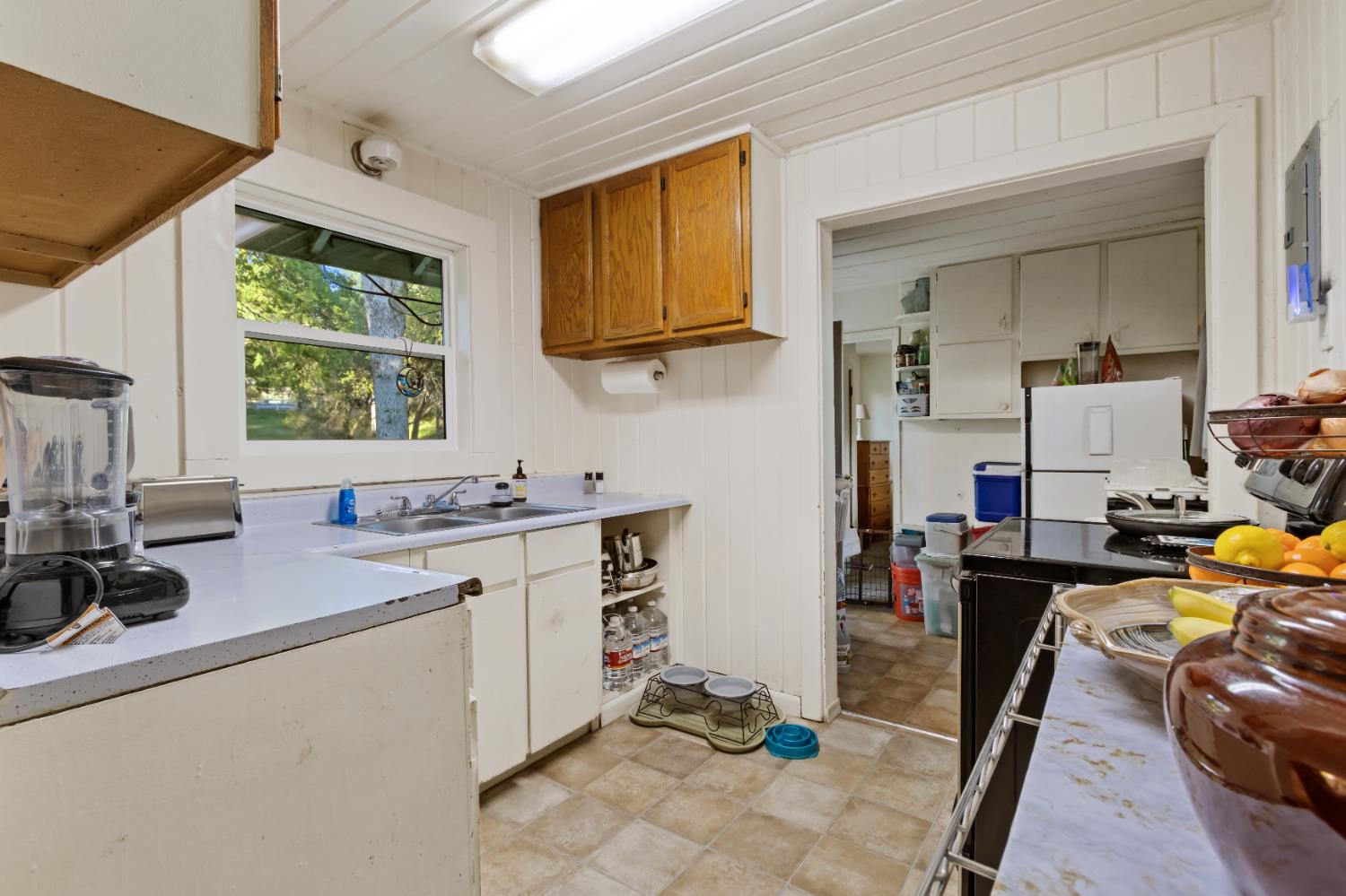 6641 Ribbon Lane Placerville, CA 95667 - Photo 7 of 21 a kitchen that has a sink and a stove in it
