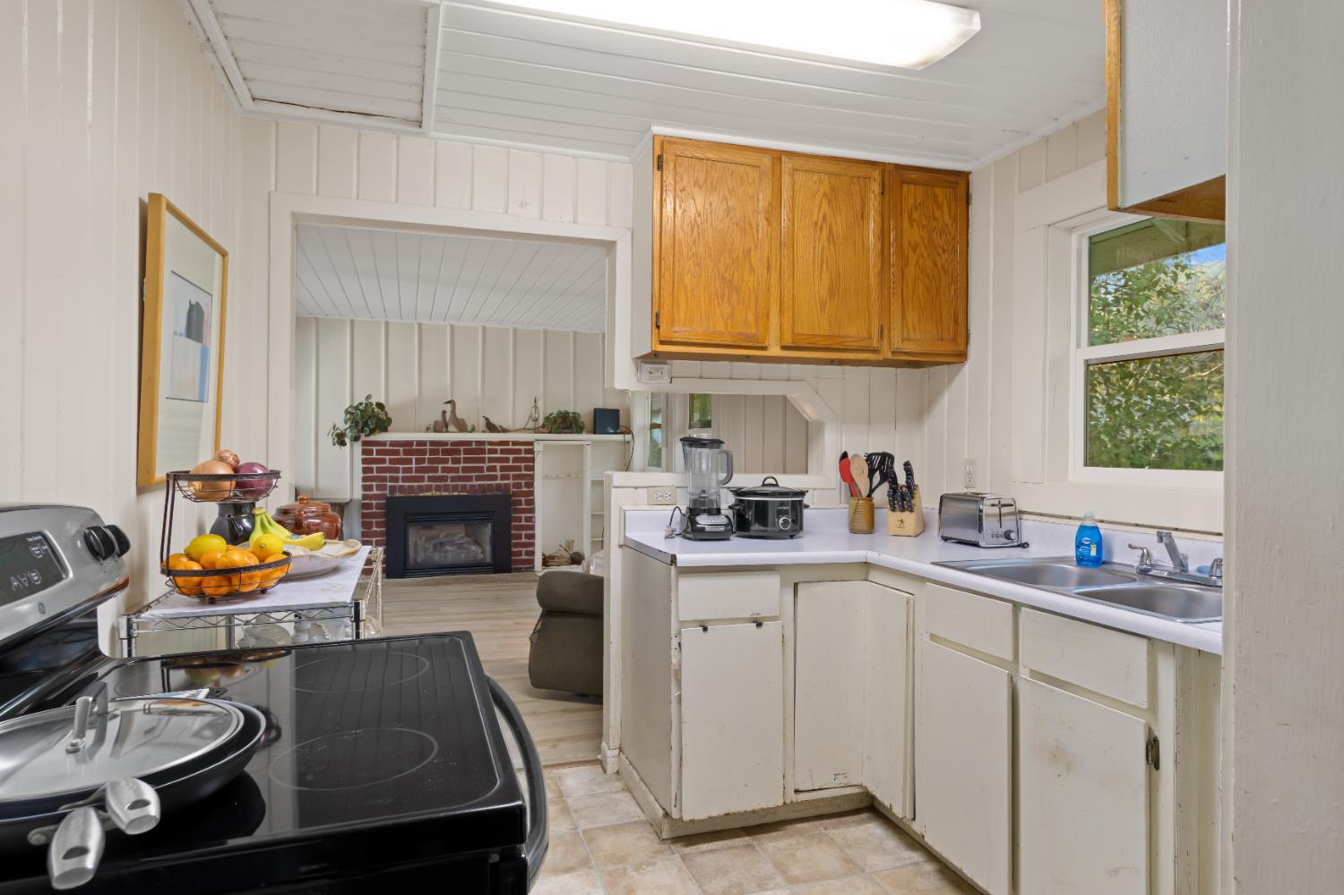 6641 Ribbon Lane Placerville, CA 95667 - Photo 8 of 21 a kitchen with stainless steel appliances a sink dishwasher stove and cabinets