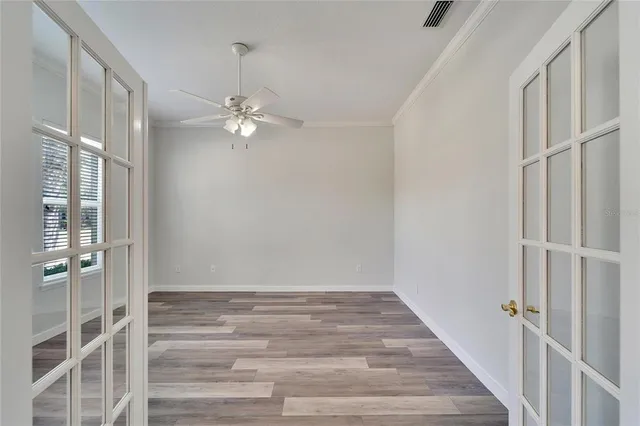 a spacious bathroom with a tub shower and mirror