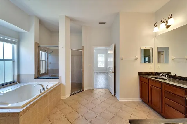 a kitchen with stainless steel appliances granite countertop a stove and a sink
