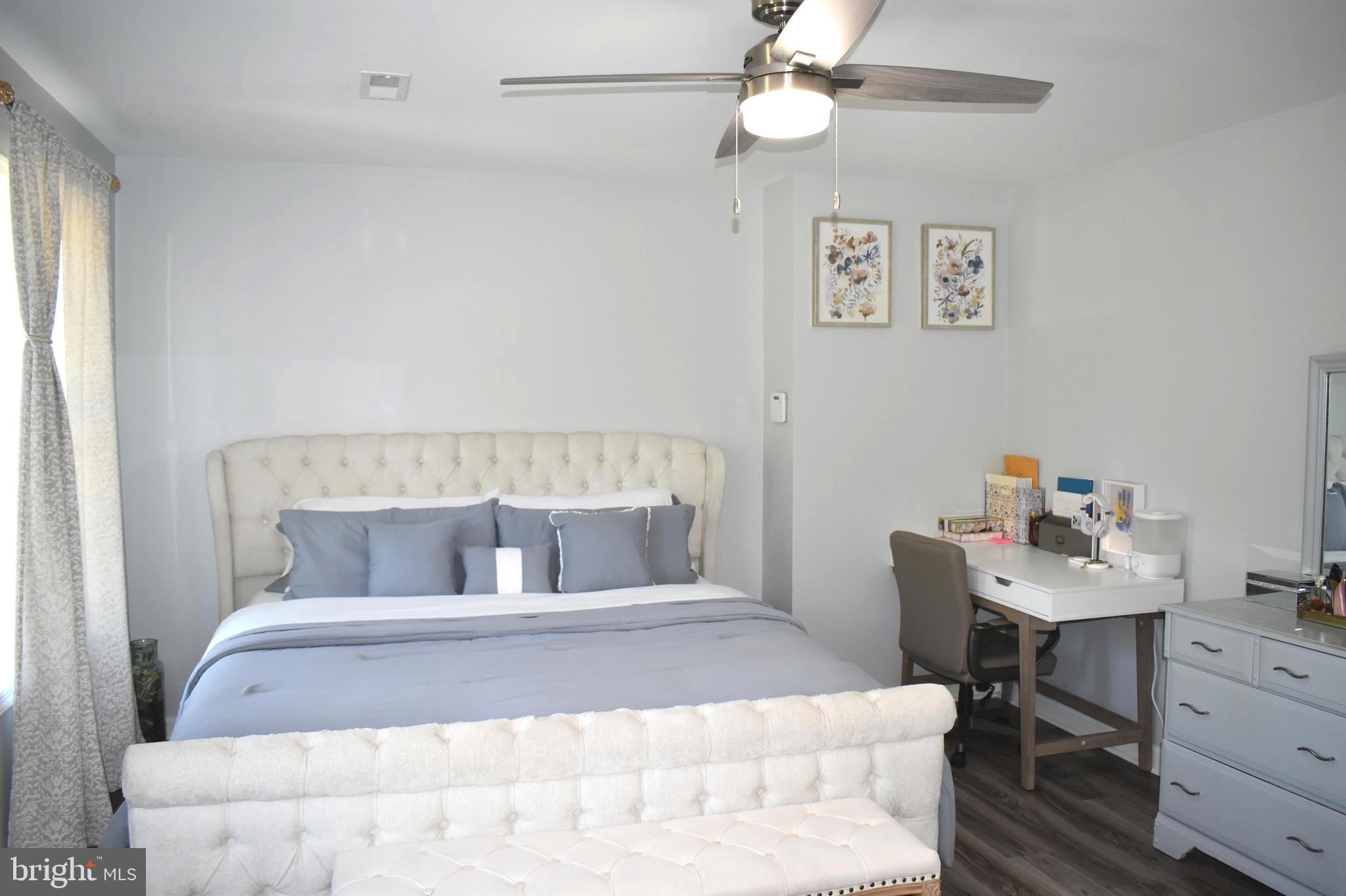 10958 Mountain Run Lake Road Culpeper, VA 22701 - Photo 17 of 31 a bedroom with a bed and a table in it