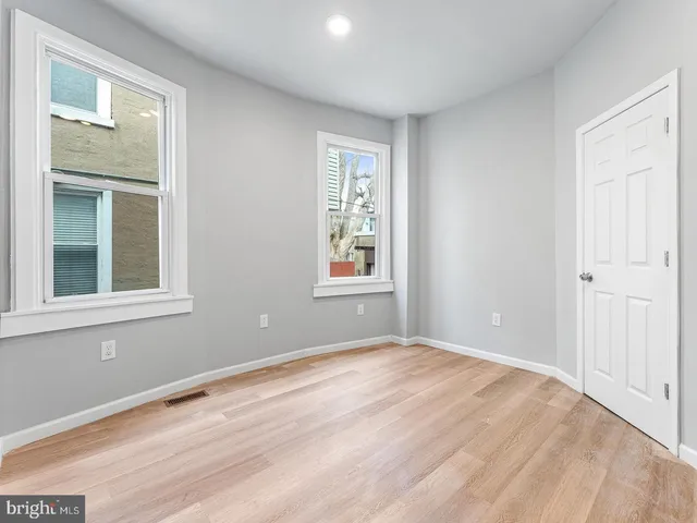 a view of empty room with windows