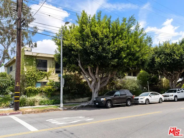 a view of street with parked cars