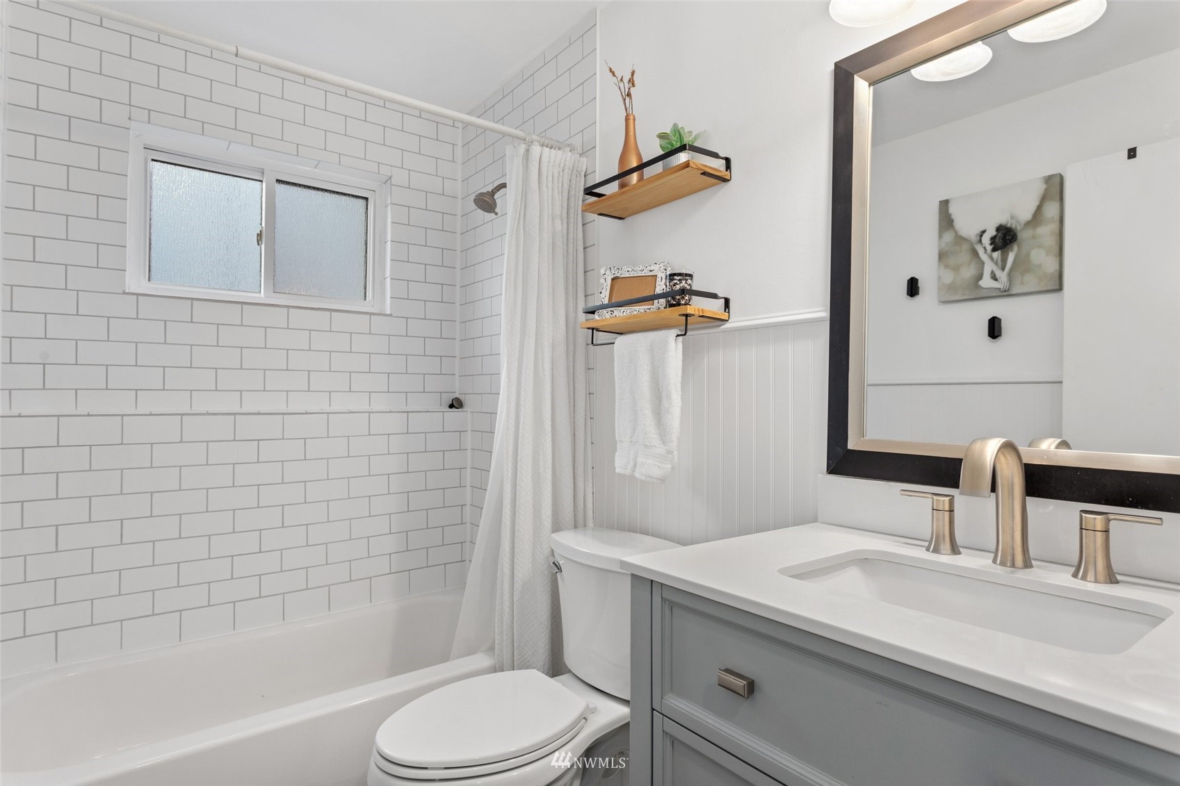 4805 Northeast 21st Street Renton, WA 98059 - Photo 14 of 40 a bathroom with a sink a toilet and shower