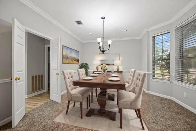 a view of a dining room with furniture window and outside view