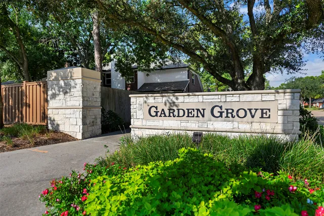 a view of outdoor space with signage and flags