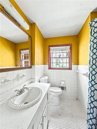a bathroom with a sink a toilet and a bathtub