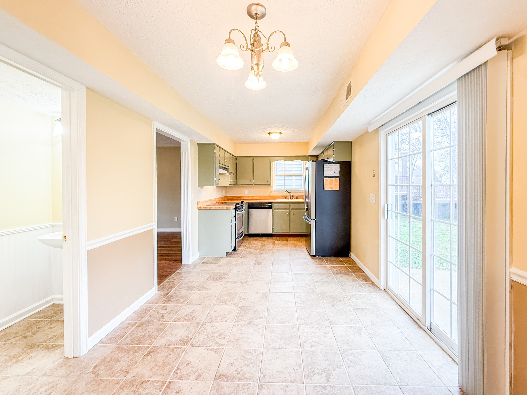 1004 Fall Parkway Murfreesboro, TN 37129 - Photo 2 of 15 a view of a kitchen with a sink and a refrigerator