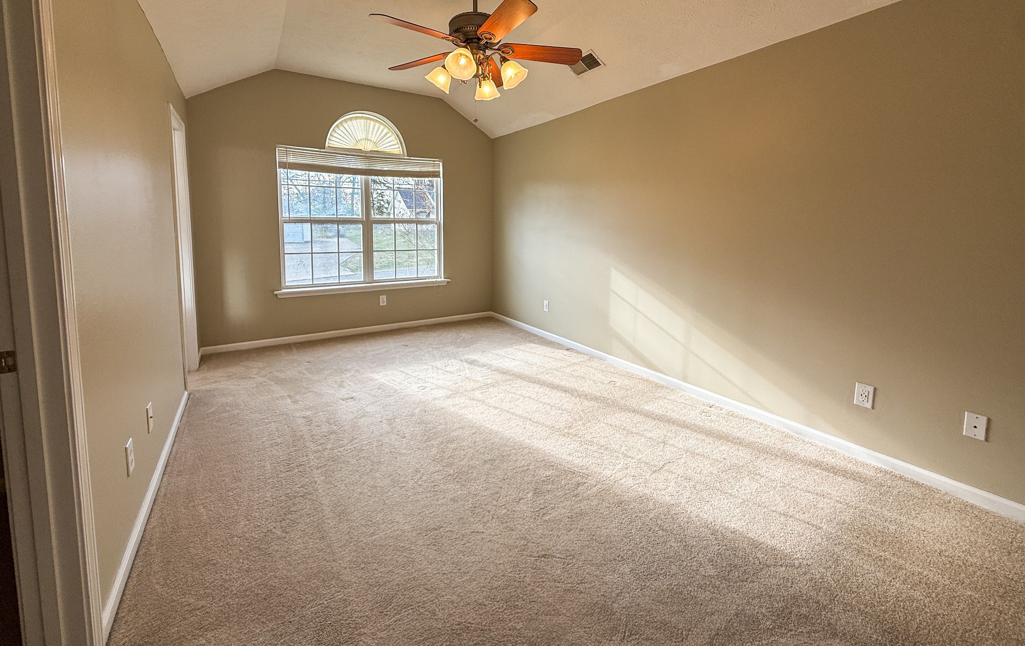 1004 Fall Parkway Murfreesboro, TN 37129 - Photo 7 of 15 an empty room with windows and chandelier fan