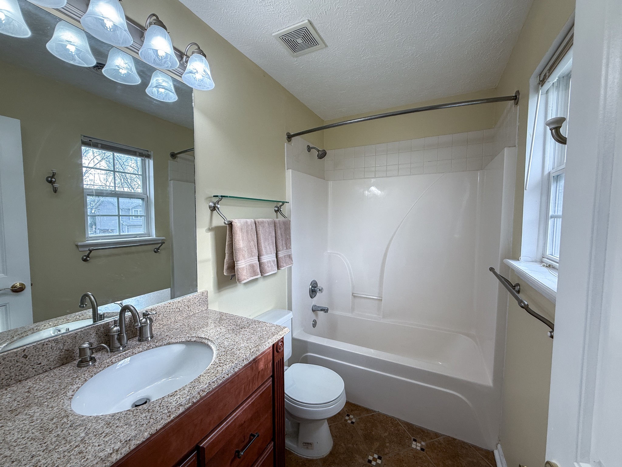 1004 Fall Parkway Murfreesboro, TN 37129 - Photo 10 of 15 a bathroom with a granite countertop sink toilet mirror and shower