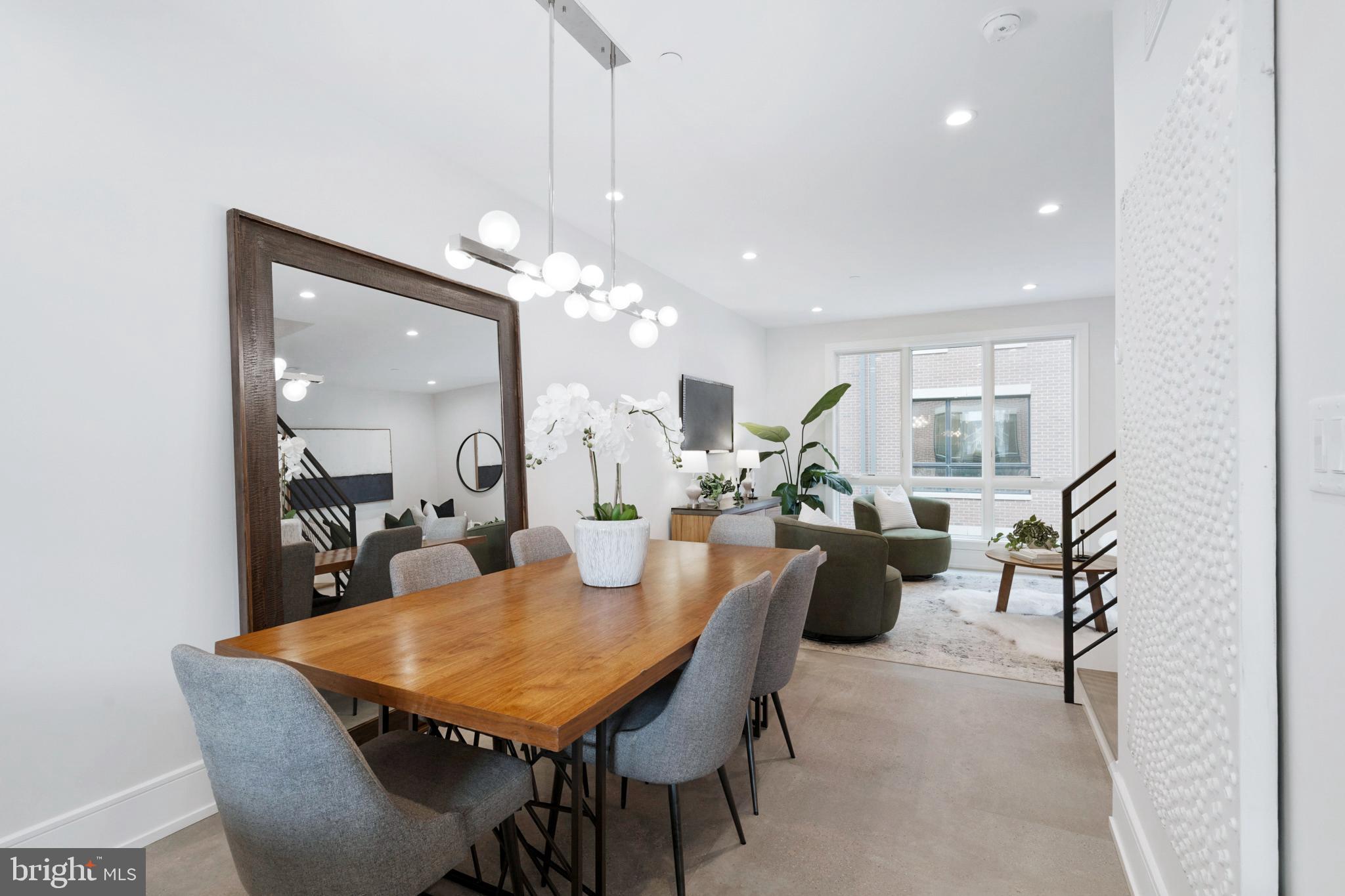2008 Renaissance Walk, Unit 5 Philadelphia, PA 19145 - Photo 17 of 94 a view of a dining room and livingroom with furniture