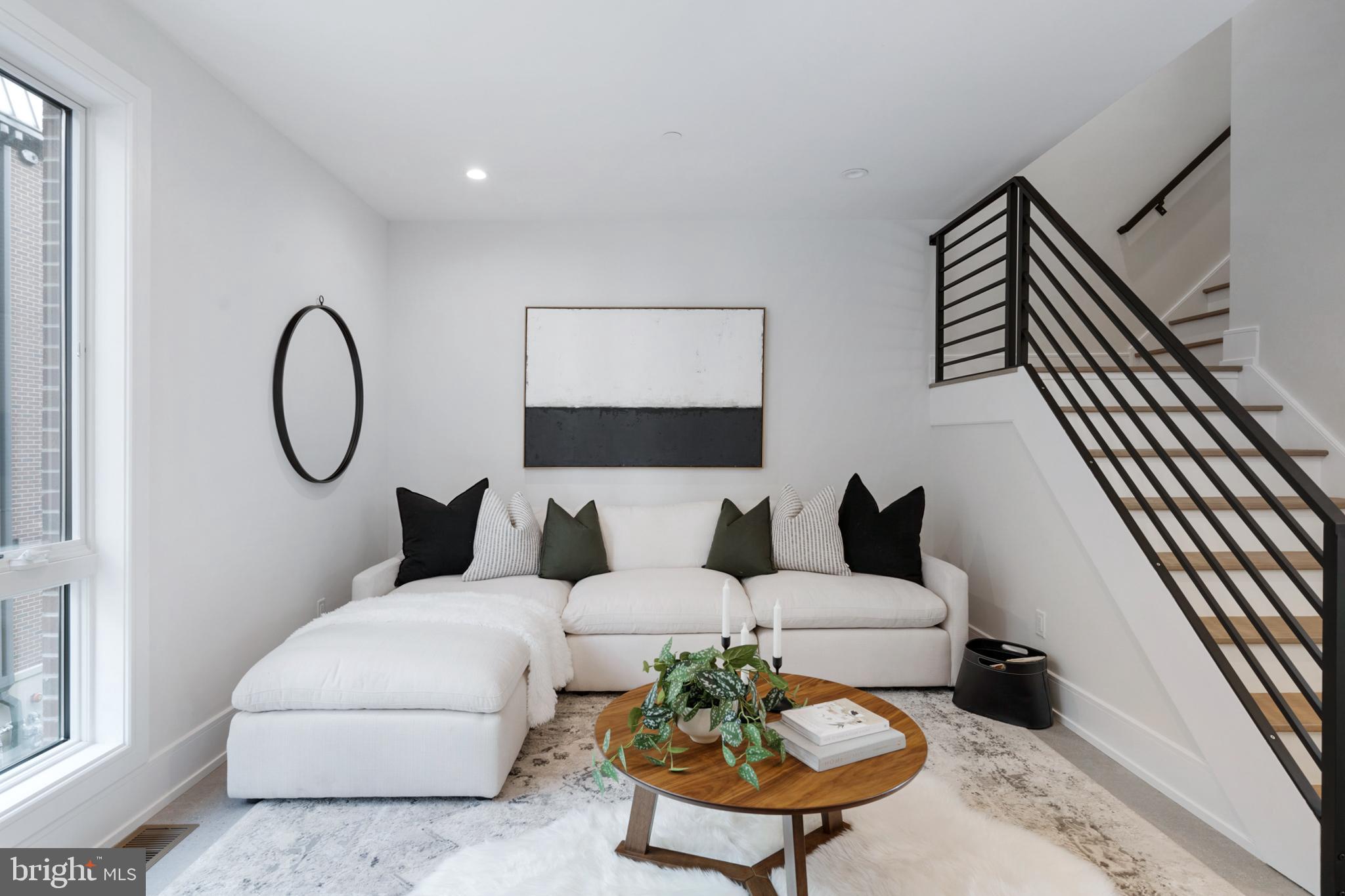 2008 Renaissance Walk, Unit 5 Philadelphia, PA 19145 - Photo 20 of 94 a living room with furniture and a rug