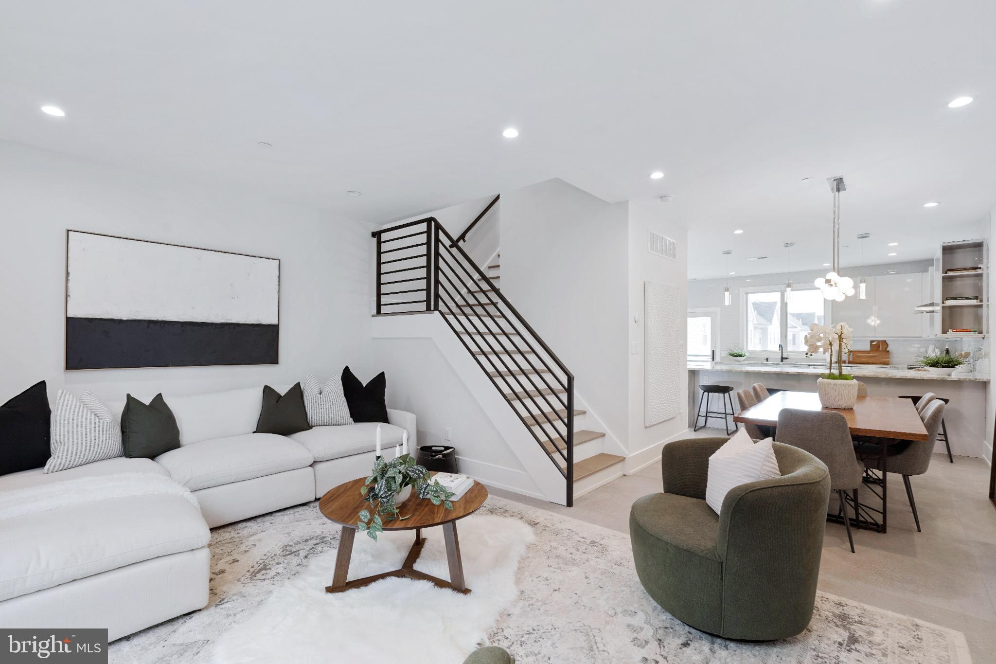 2008 Renaissance Walk, Unit 5 Philadelphia, PA 19145 - Photo 21 of 94 a living room with furniture and a large window
