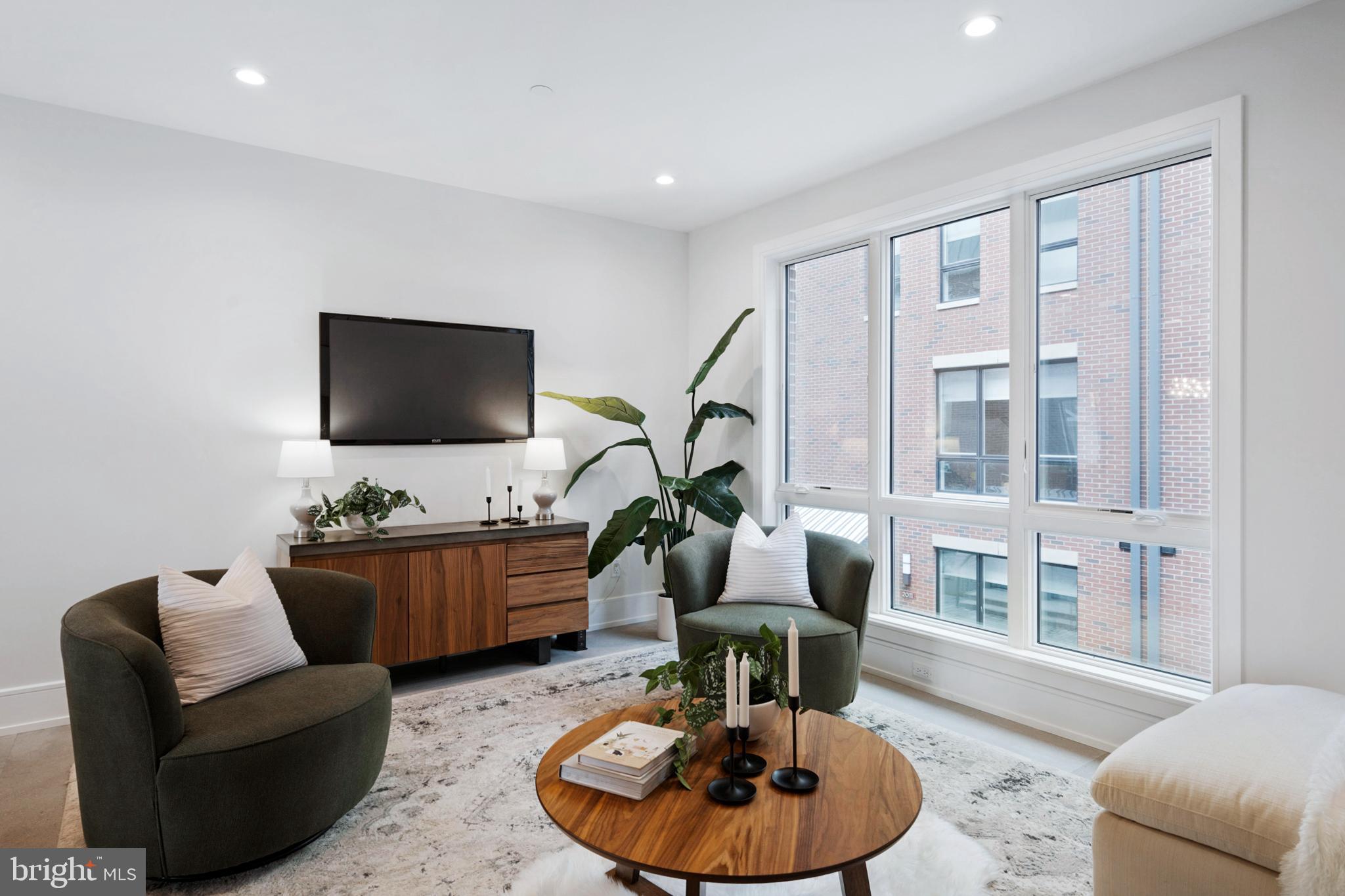 2008 Renaissance Walk, Unit 5 Philadelphia, PA 19145 - Photo 22 of 94 a living room with furniture and a flat screen tv
