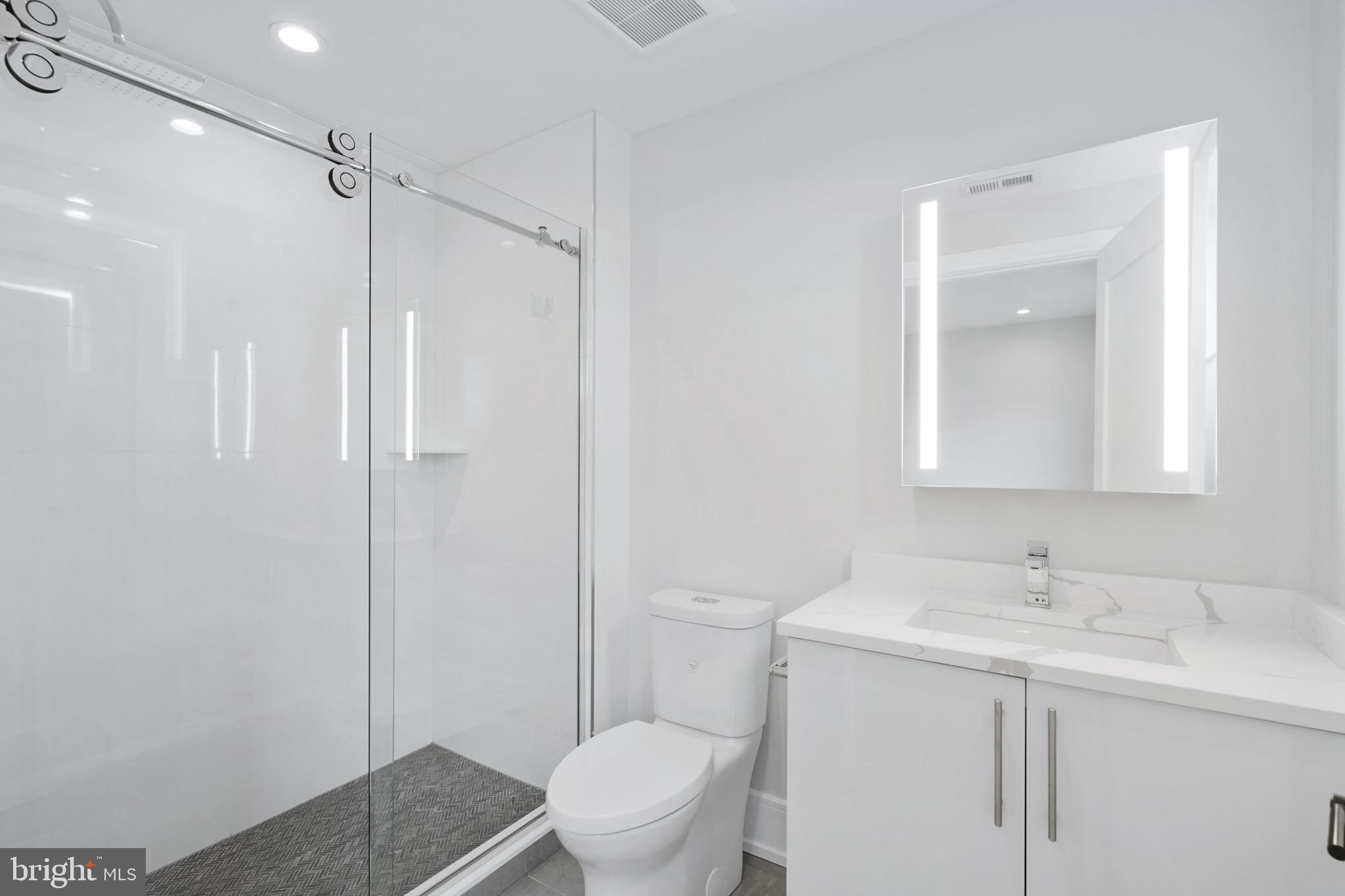 2008 Renaissance Walk, Unit 5 Philadelphia, PA 19145 - Photo 32 of 94 a bathroom with a sink toilet and shower