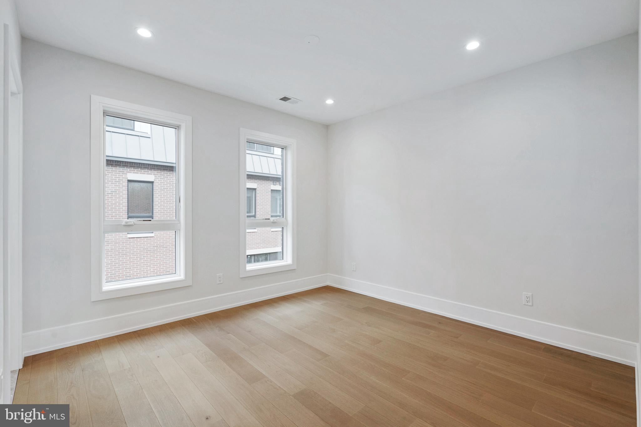 2008 Renaissance Walk, Unit 5 Philadelphia, PA 19145 - Photo 34 of 94 a view of empty room with wooden floor and fan