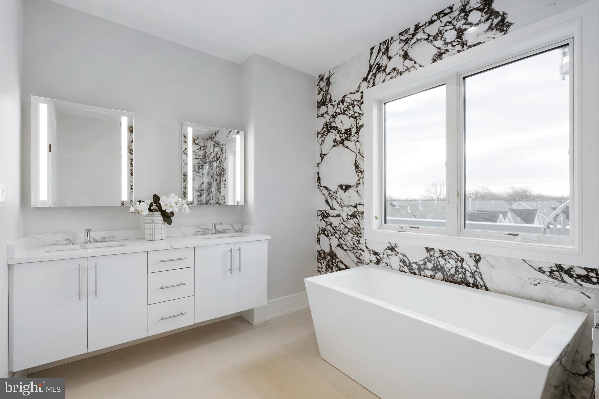 2008 Renaissance Walk, Unit 5 Philadelphia, PA 19145 - Photo 41 of 94 a white bath tub sitting next to a white sink