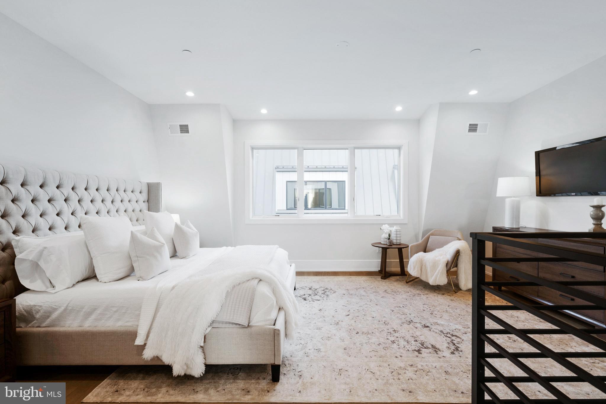 2008 Renaissance Walk, Unit 5 Philadelphia, PA 19145 - Photo 44 of 94 a bedroom with a bed and wooden floor