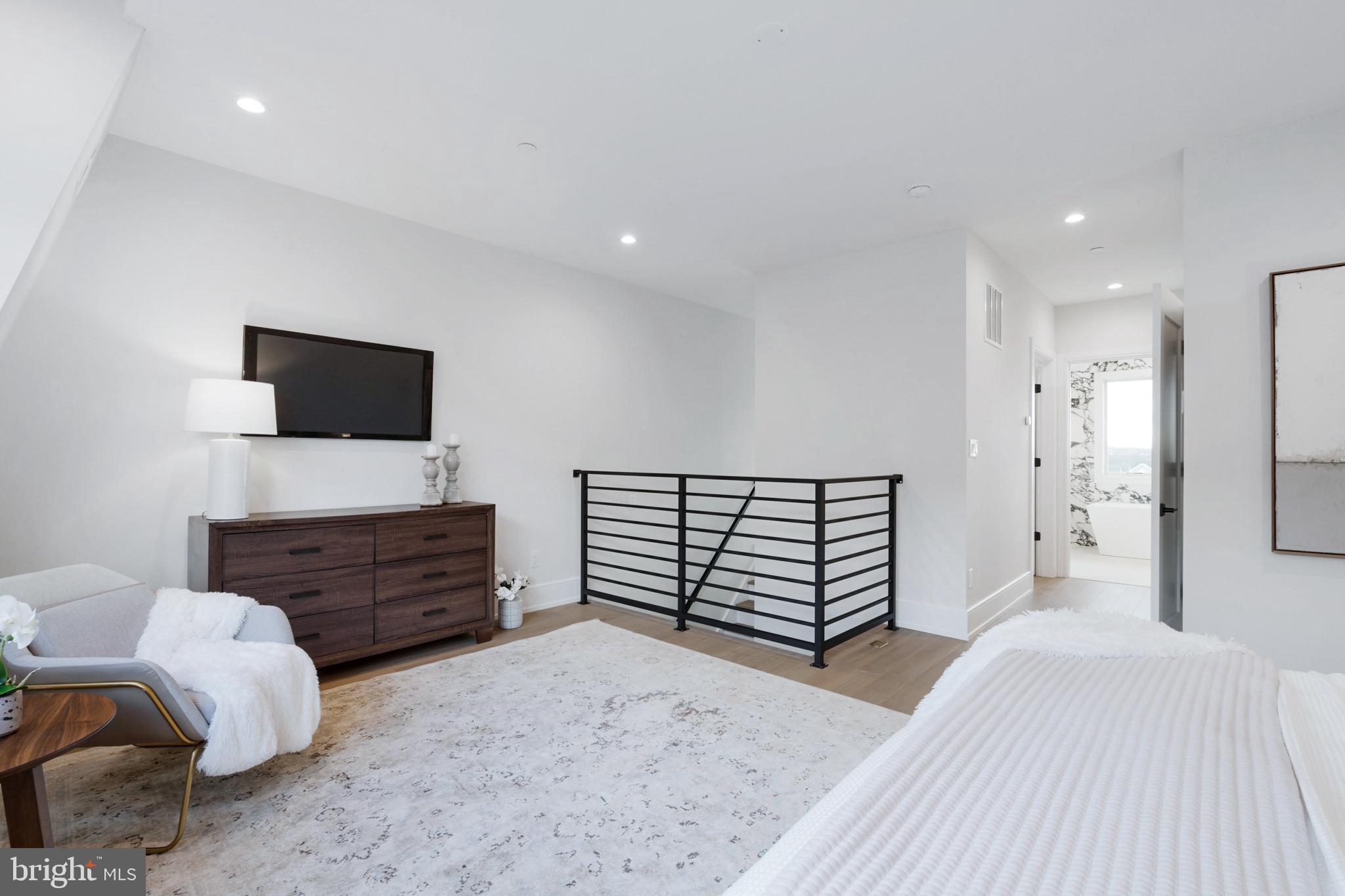 2008 Renaissance Walk, Unit 5 Philadelphia, PA 19145 - Photo 47 of 94 a bed room with furniture and a flat screen tv