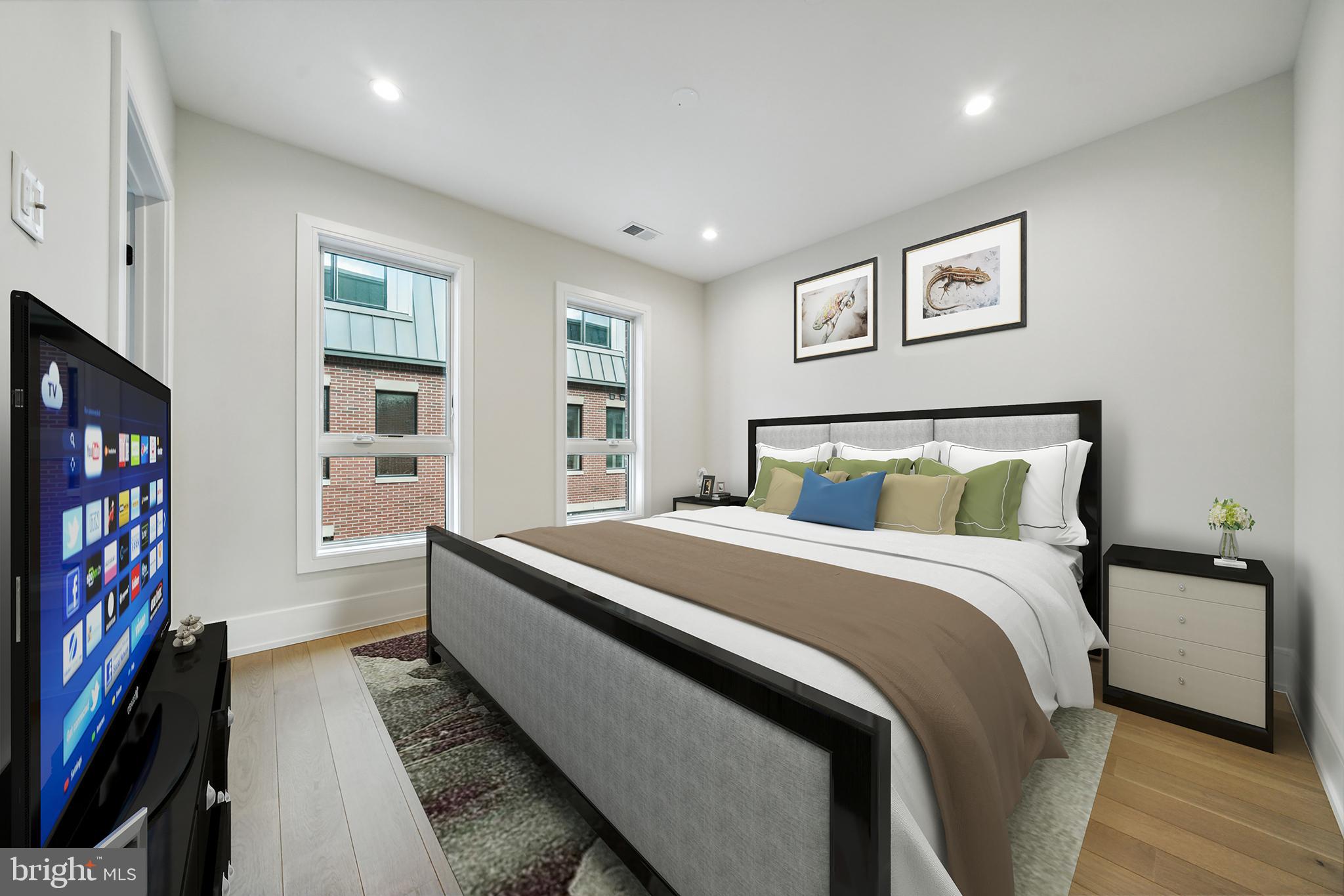 2008 Renaissance Walk, Unit 5 Philadelphia, PA 19145 - Photo 55 of 94 a bedroom with bed and a book shelf