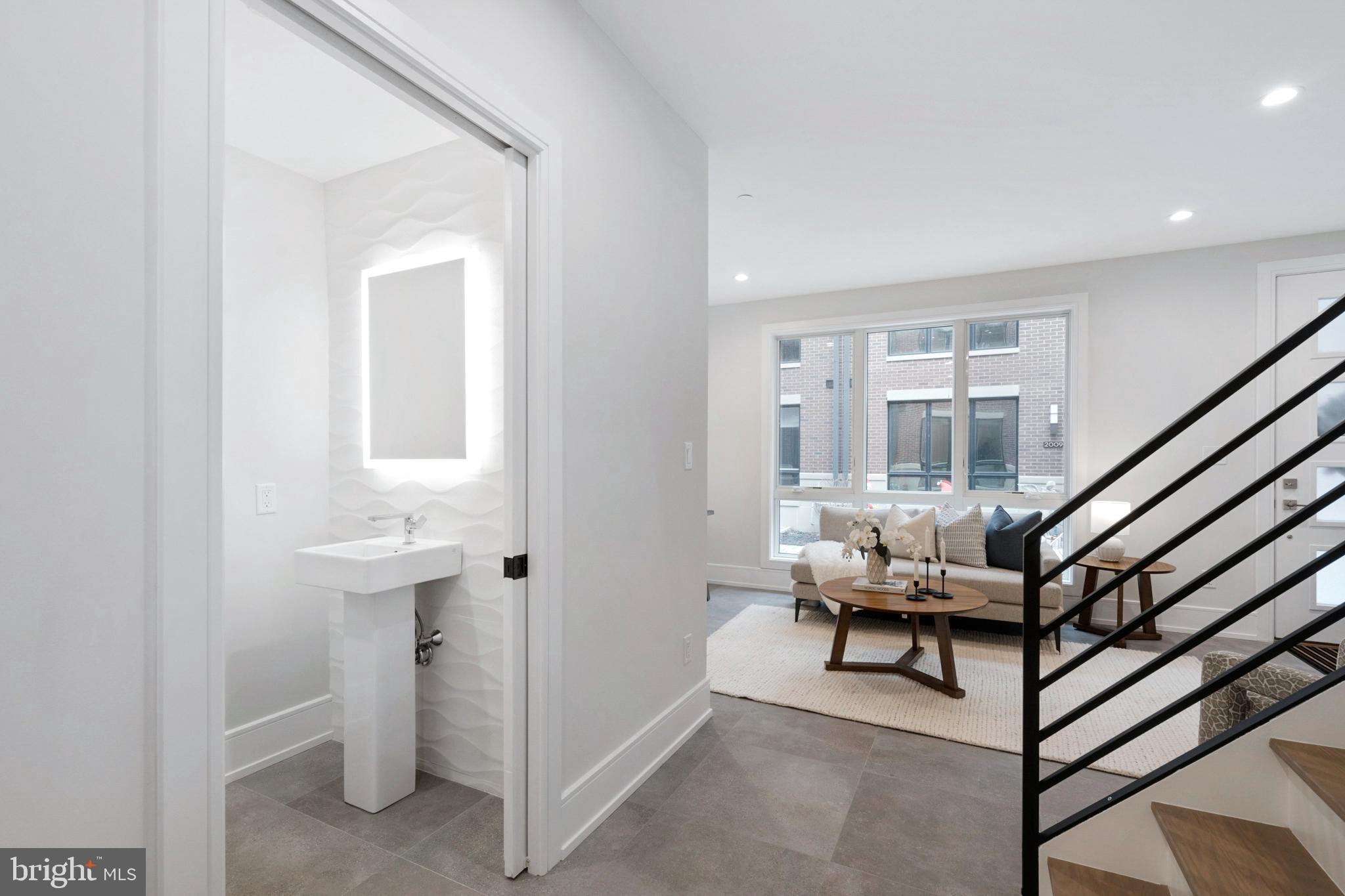 2008 Renaissance Walk, Unit 5 Philadelphia, PA 19145 - Photo 6 of 94 a view of entryway kitchen and hall with wooden floor