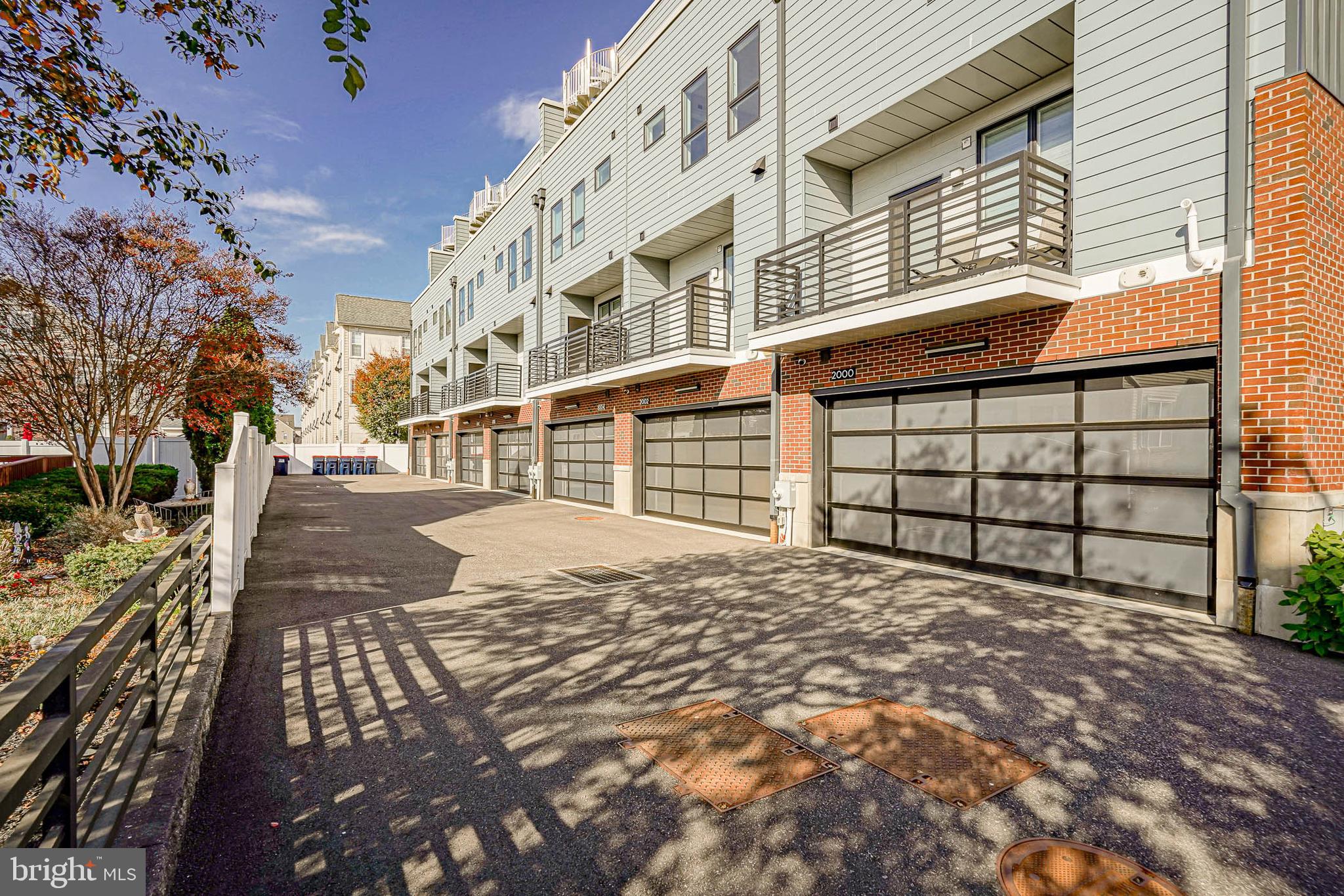2008 Renaissance Walk, Unit 5 Philadelphia, PA 19145 - Photo 92 of 94 a view of a backyard with a large tree