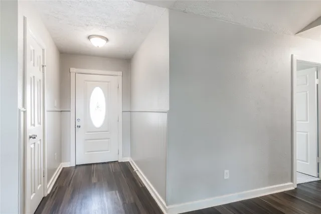 a view of a livingroom with wooden floor
