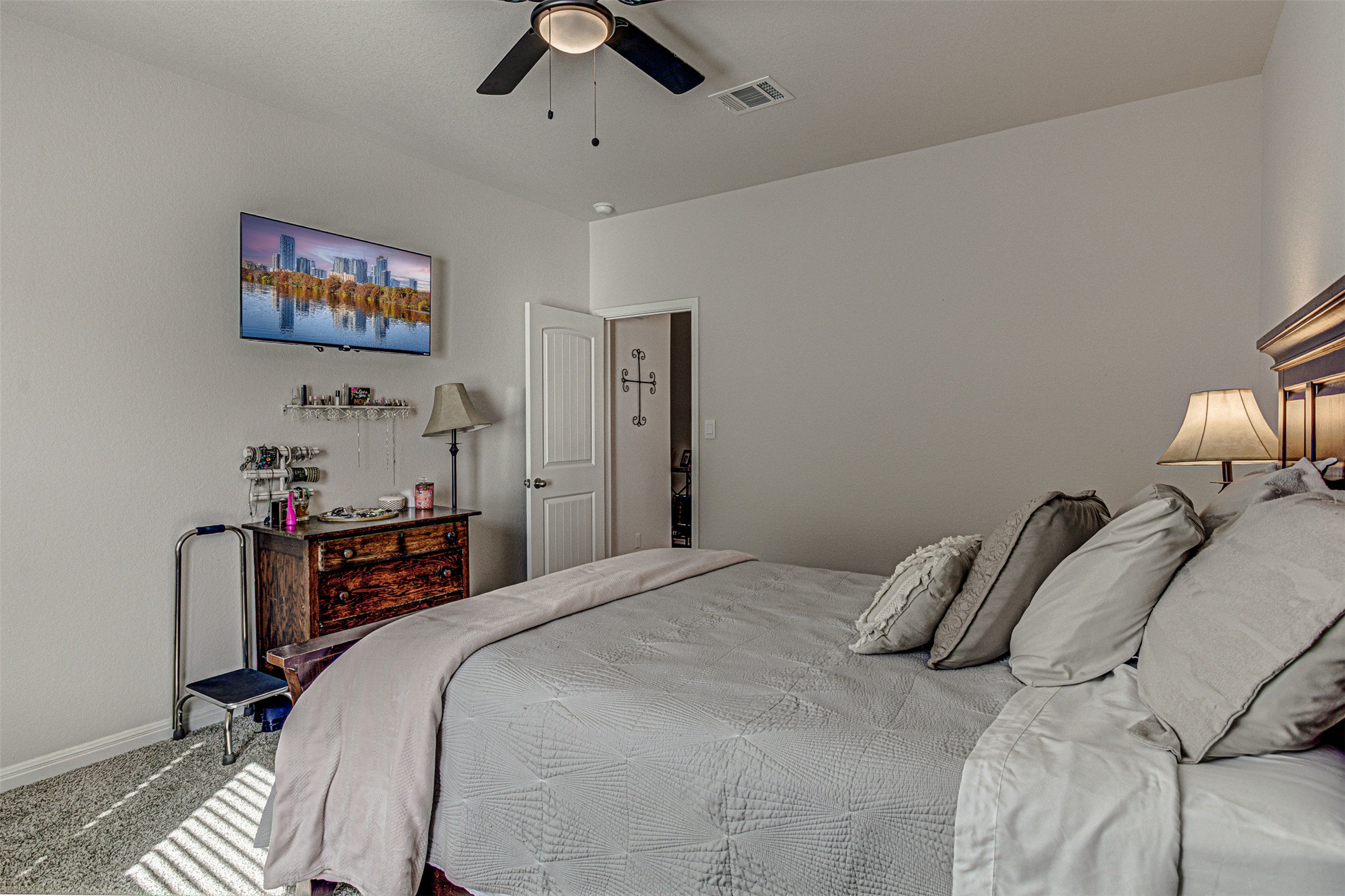309 Lone Cedar Road Marble Falls, TX 78654 - Photo 19 of 35 Bedroom featuring ceiling fan and carpet flooring