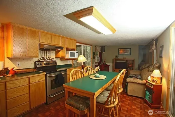 a room with furniture a flat screen tv and a window