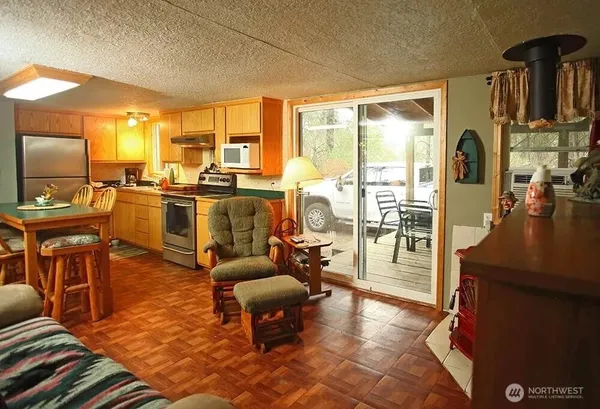 a living room with fireplace furniture and a flat screen tv