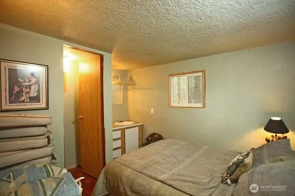 a bedroom with a bed and furniture