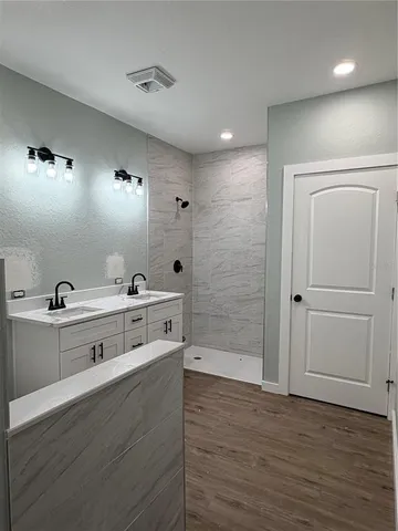 a view of room with wooden floor