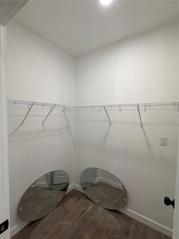 a room with a rug and a window