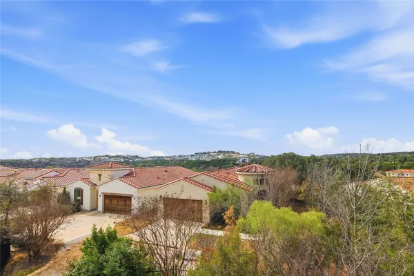 a view of a lake with houses in the back