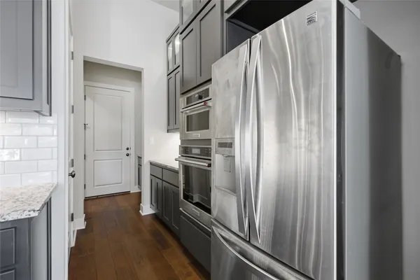 a kitchen with a refrigerator and countertop