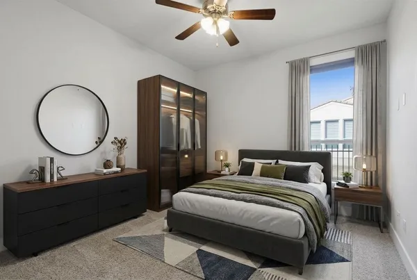 a bedroom with a bed and a mirror