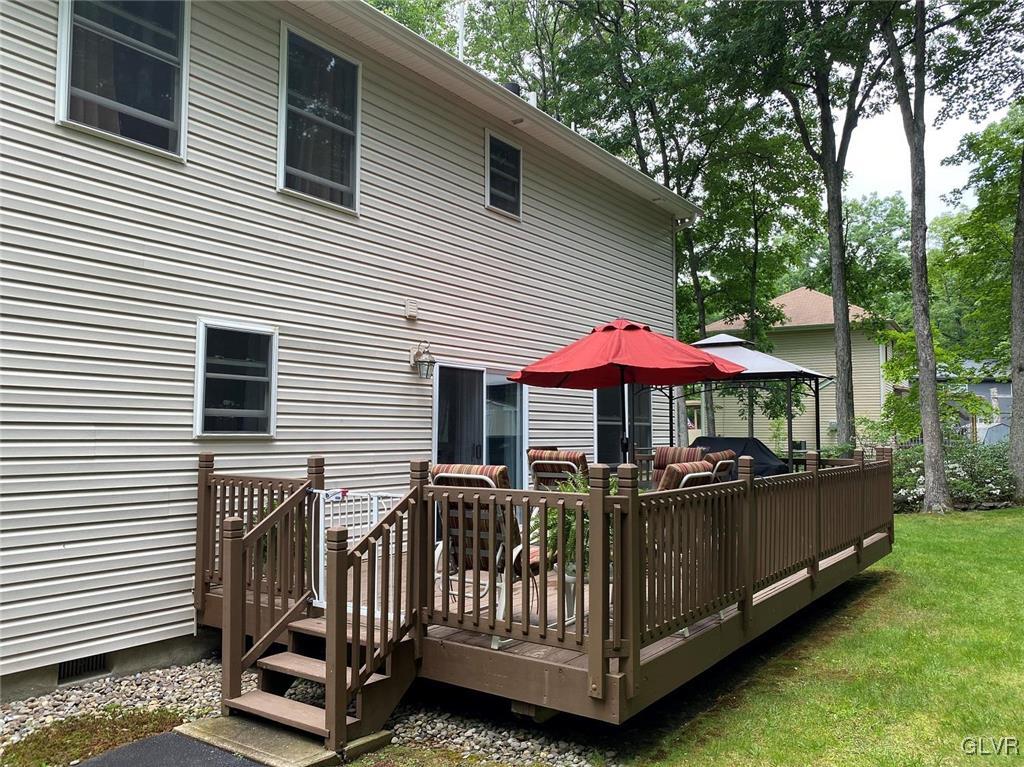 142 Colette Lane Dingmans Ferry, PA 18328 - Photo 13 of 14 a view of a chairs with a small deck